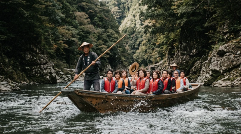 Traditional wooden boat with passengers descending the Hozukyo Gorge rapids on the Hozugawa river boat ride from Kameoka to Arashiyama